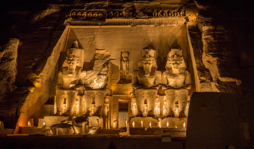 Image of the magnificent Abu Simbel temple complex, which includes massive statues of Pharaoh Ramses II and is located on the banks of the Nile River in southern Egypt.