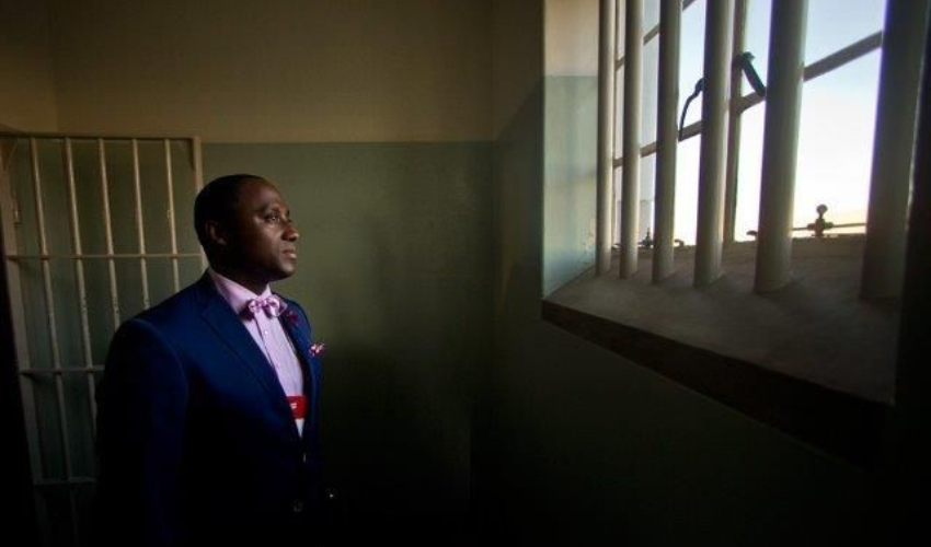 Sherwin in Nelson Mandela's Cell at  Robben Island