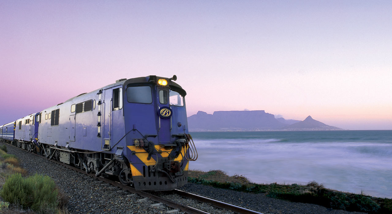Luxury Train Travel in South Africa with the Iconic Table Mountain in the background